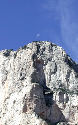 Photo - El Capitan, Guadalupe National Park, Texas, with moon just above crest of mountain