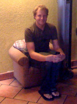 Photo of Kyle in tiny armchair