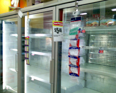 Photo - Empty freezer shelves where ice cream should be