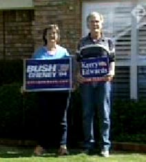 Photo - Jan & Richard Rose hold dueling campaign signs
