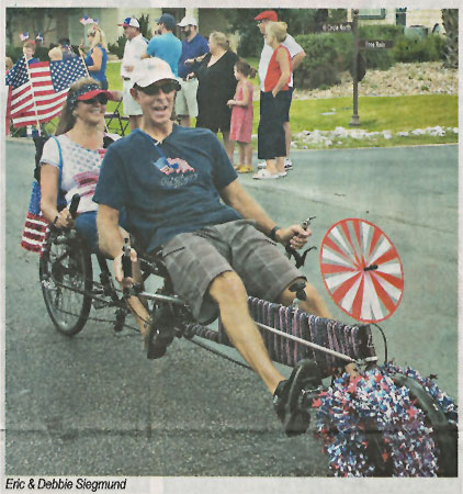 Photo in the Horseshoe Bay Beacon of us riding our bike in the parade