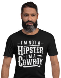 Bearded guy wearing a t-shirt that reads I'm not a hipster; I'm a cowboy