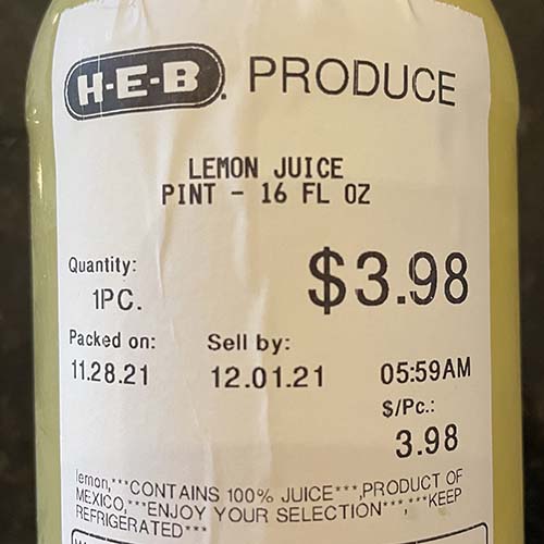 Photo - Label on a bottle of lemon juice showing a price of $3.98