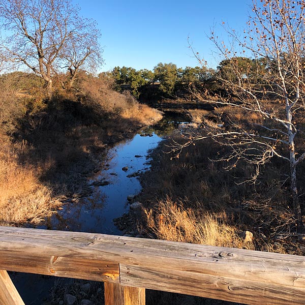 Photo - A view of Pecan Creek between from the Summit Rock bridge