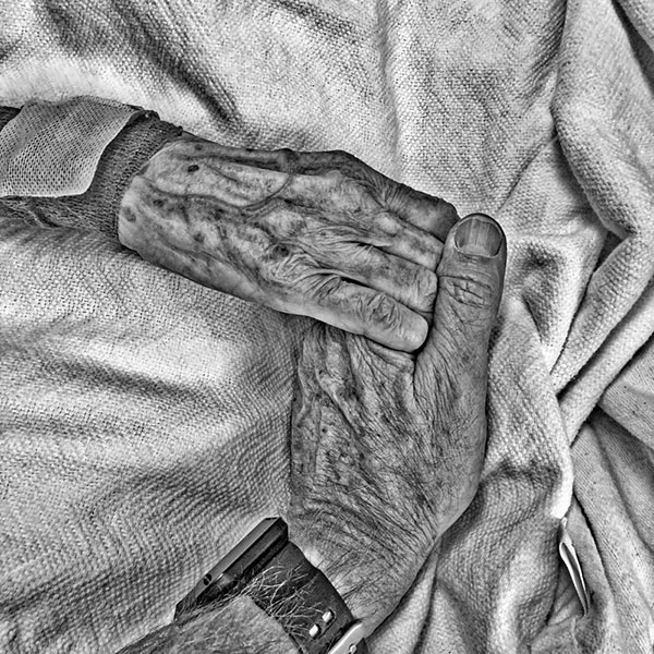 B&W image: Holding hands with my mother in the hospital