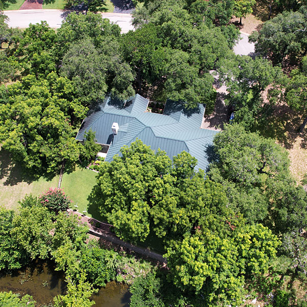 Photo - Our tree-surrounded house as seen from a drone hovering at around 75 feet