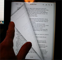 Photo of iBook with page half-turned
