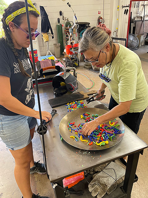 Photo: Action in the hot shop of Garcia Art Glass