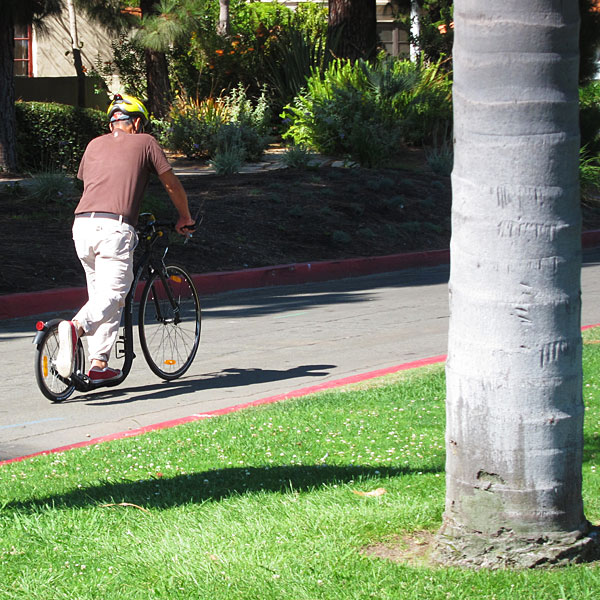 Photo: Man riding a weird scooter