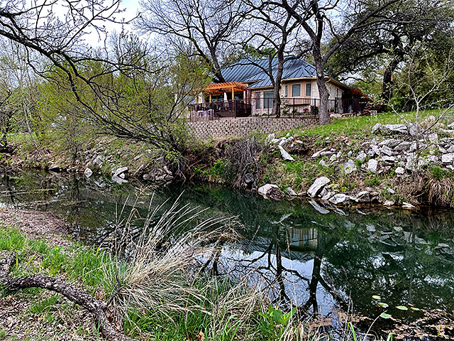 Photo: Our house as viewed from the opposite bank of the creek