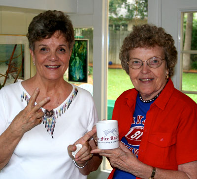 Photo of my aunts holding a Gazette coffee mug